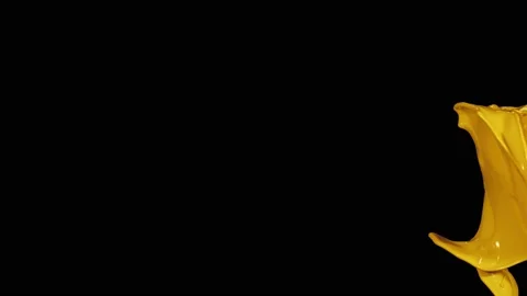 Yellow paint splash thrown in slow motion, liquid isolated on black (4K) Stock Footage 137112105