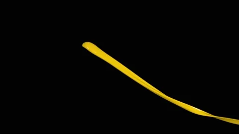 Yellow paint splash thrown in slow motion, liquid isolated on black (4K) 動画素材 137112843