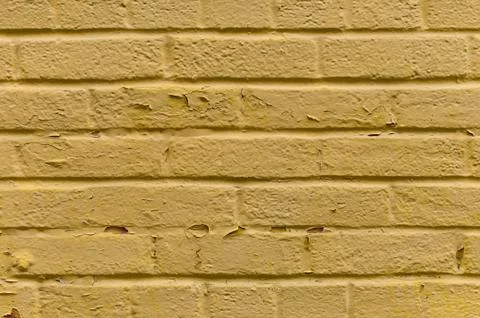 Yellow painted brick wall background Stock Photos