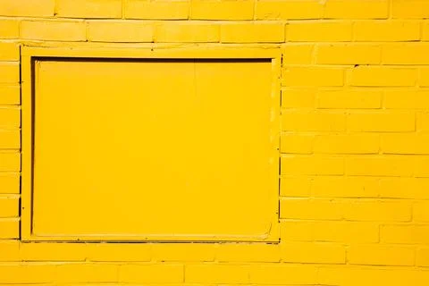 Yellow painted brick wall background Foto stock
