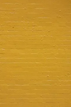 Yellow Painted Brick Wall Stock Photos