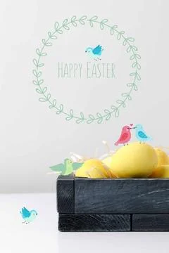Yellow painted easter eggs wooden Stock Photos