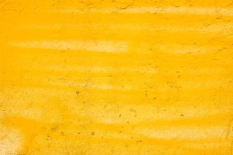 Yellow painted plaster wall texture Stock Photos