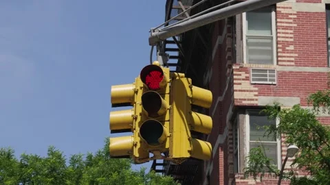 Yellow painted red stop light for three way intersection turns to a green li Stock Footage 242365926