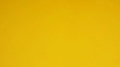 Yellow paper for background.it is empty space and no people. Stock Photos