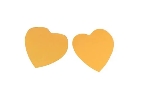Yellow paper heart shapes with patterned fabric on white background Stock Photos