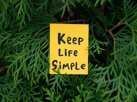 A yellow paper note with the phrase Keep Life Simple on it Stock Photos