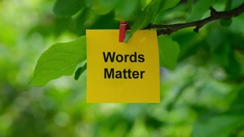 A yellow paper note with the phrase Words Matter on it Stock Footage 252279041