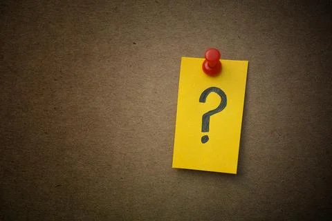 A yellow paper note with a question mark on it Stock Photos