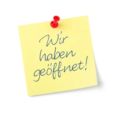 Yellow paper note with text  We are open in german - Wir haben geffnet Stock Photos