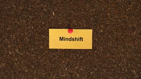 A yellow paper note with the word Mindshift Stock Photos