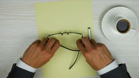 Yellow paper for notes with pen and glasses. Stock Footage 95551579