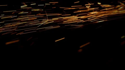 Yellow particles emit on black background macro shot Stock Footage 98480443