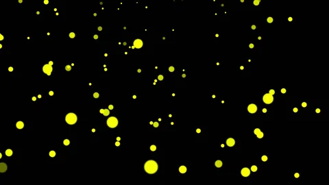 YELLOW particles glowing on the black background. Black background with light Stock Footage 218576104