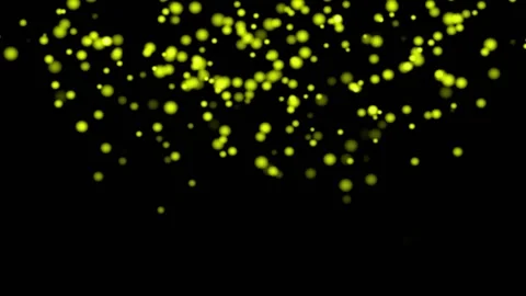 YELLOW particles glowing on the black background. Black background with light Stock Footage 218579111