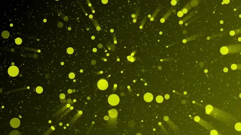 Yellow particles with yellow light rays background Video stock 220661380