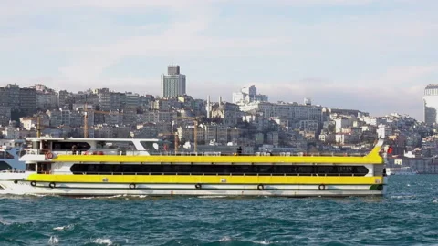 Yellow passenger ship passes through the waters of the Bosphorus. Stock Footage 112343056