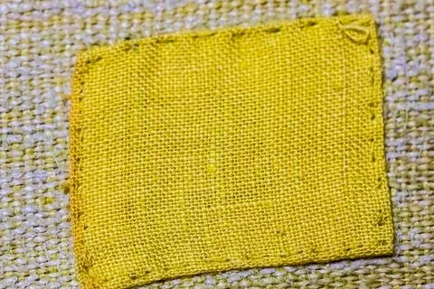 Yellow patch on a cloth Foto stock