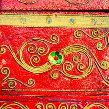 Yellow pattern on textured bright red colour board Stock-Fotos