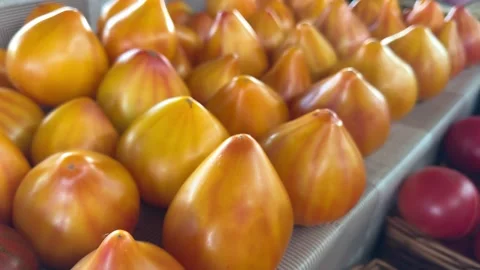 Yellow Pear Shaped Heirloom Tomatoes Displayed at Farmers Market Showing Stock Footage 345178620