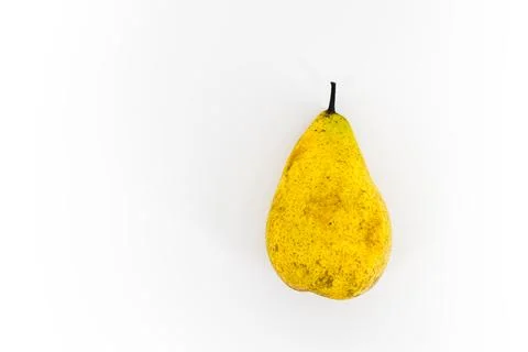 Yellow pear on the white background. Stock Photos