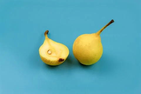 Yellow pears on blue background Stock Photos