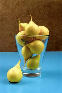 Yellow pears on blue background Foto stock