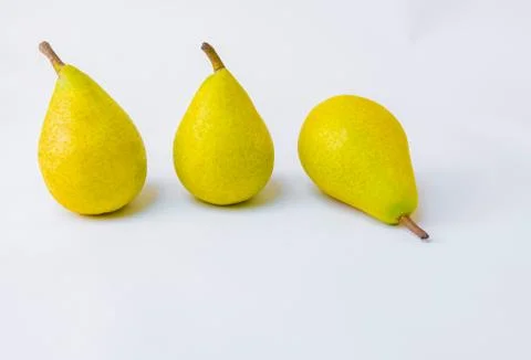Yellow pears on white background Stock Photos