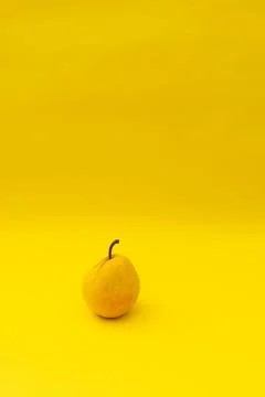 Yellow pears on a yellow background Stock Photos