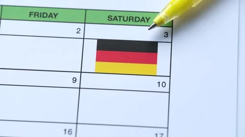A yellow pen points to the Day of German Unity date of October 3rd Stock Footage 340556950