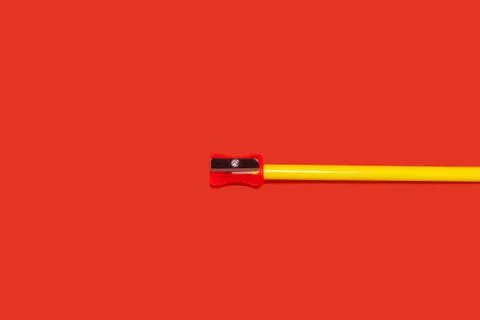 Yellow pencil with sharpener on it Stock Photos