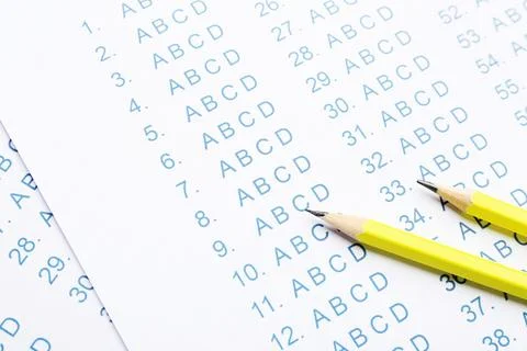 Yellow pencils on answer sheets, closeup view Stock Photos