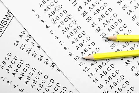 Yellow pencils on answer sheets, top view Stock Photos