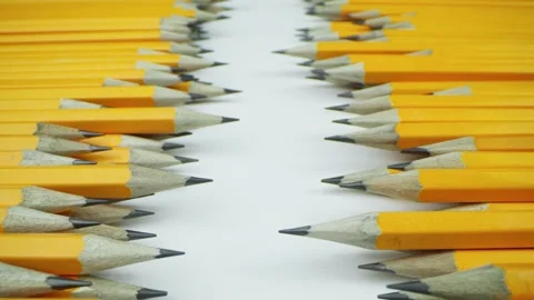 Yellow pencils randomly lie on a white background Видео 140446488