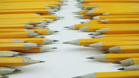 Yellow pencils randomly lie on a white background Video stock 192475587