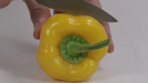 Yellow pepper being chopped for cooking Video stock 72512909