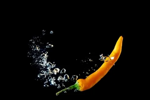 Yellow pepper bubbles on black Stock Photos