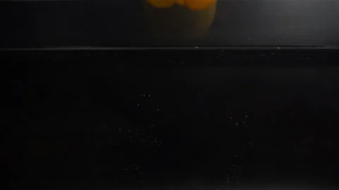 Yellow Pepper Falling in Water with Splash in Slow Motion Stock Footage 104726813