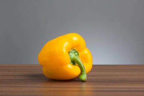 Yellow pepper, raw, on table 스톡 사진
