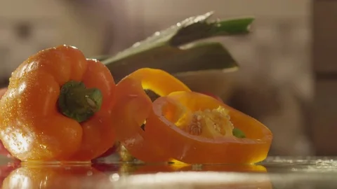 Yellow pepper slice bounce on glass RAPID 100fps (FEW SHOTS) Stock Footage 74652507