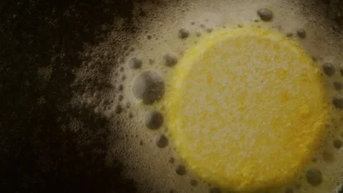 Yellow pill dissolving in liquid Stock Footage 255666571