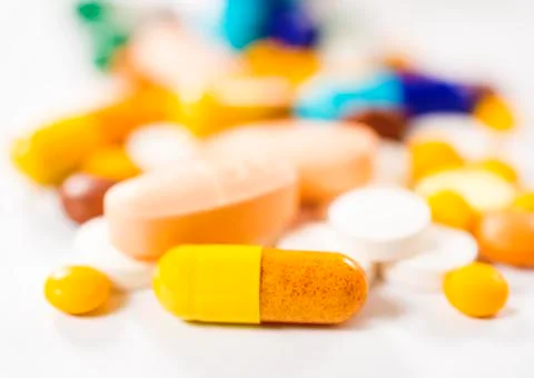 Yellow pill Stock Photos