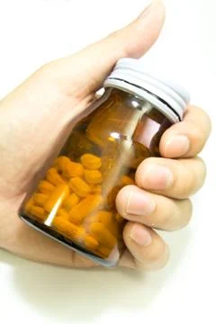Yellow pill Stock Photos