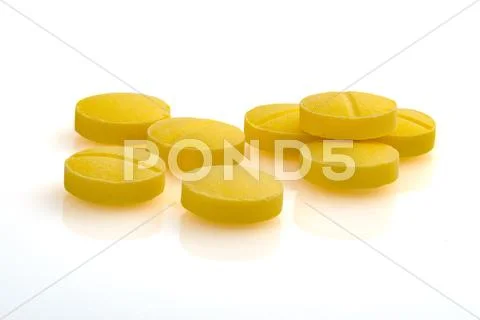 Yellow pills closeup macro photography Stock Photos