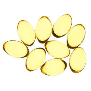 Yellow pills isolated background Stock Photos
