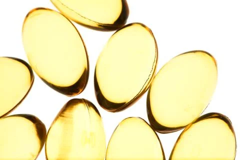 Yellow pills isolated background Stock Photos