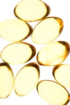 Yellow pills isolated background Stock Photos