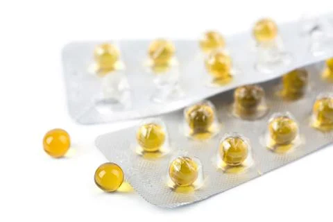 Yellow pills isolated Stock Photos