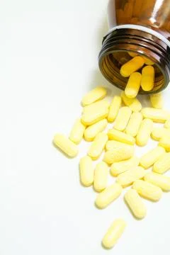 Yellow pills Stock Photos