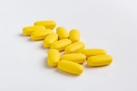 Yellow pills Stock Photos